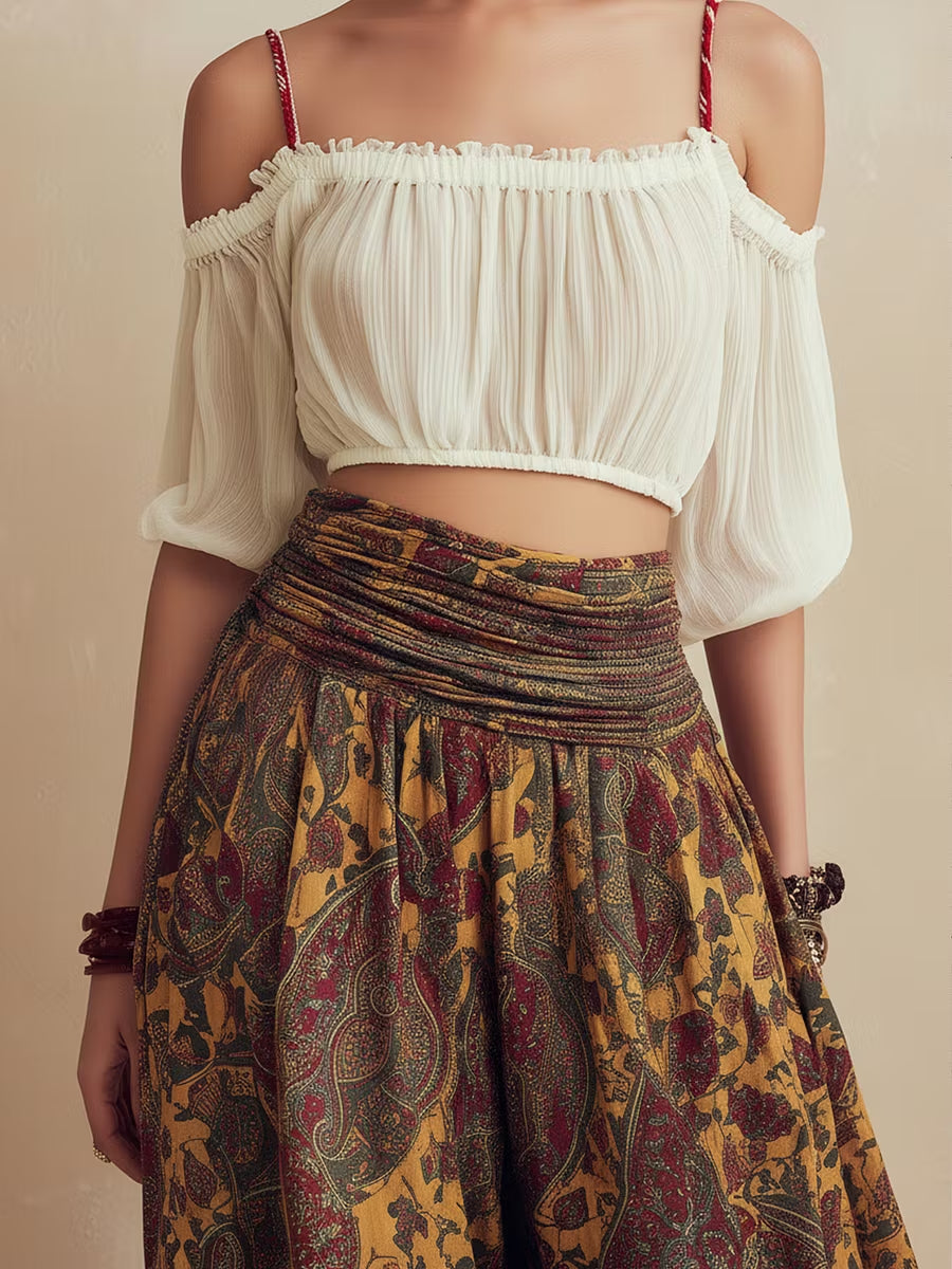 Off-the-shoulder crop top paired with printed wide-leg pants set