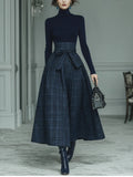 Dark blue turtleneck stretch top and plaid skirt set